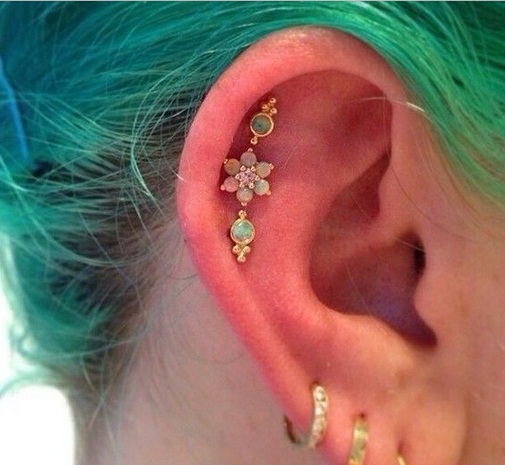 Outer Conch Piercing With Gem Flower Studs