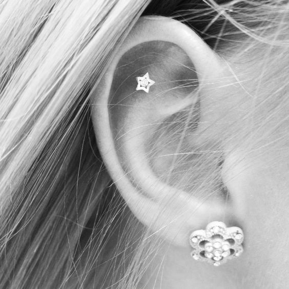Outer Conch Piercing With Star Stud