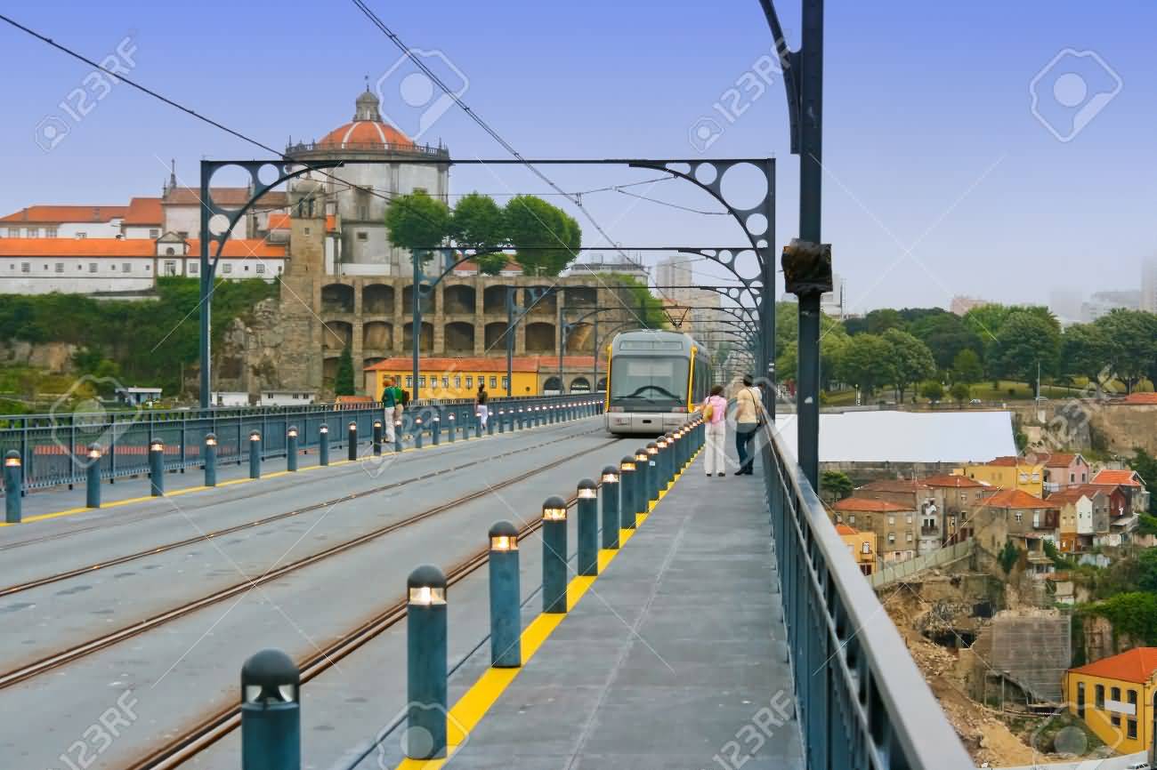 Railroad With Moving Tram At Dom Luis Bridge In Portugal