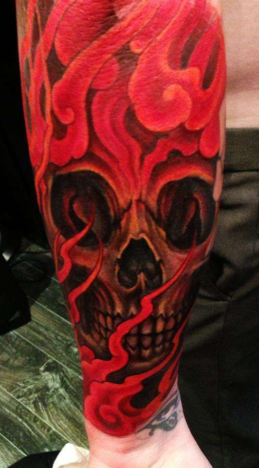 Red And Grey Ink Flame Skull Tattoo On Arm Sleeve