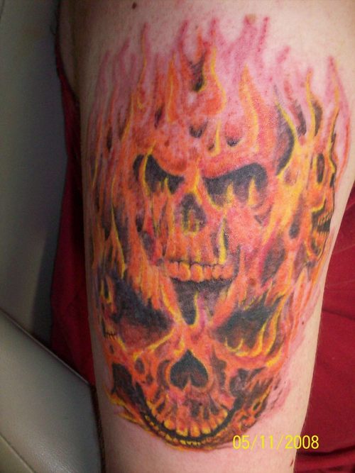 Red And Yellow Evil Flame Skull Tattoo On Half Sleeve