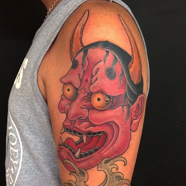 Red Ink Demon Head Tattoo On Shoulder by Chris Garver