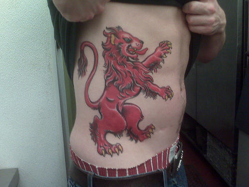 Red Scottish Symbol Tattoo On Side Rib For Men