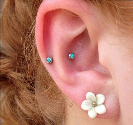 Right Ear Lobe With Flower Stud And Outer Conch Piercing With Blue Opal Studs
