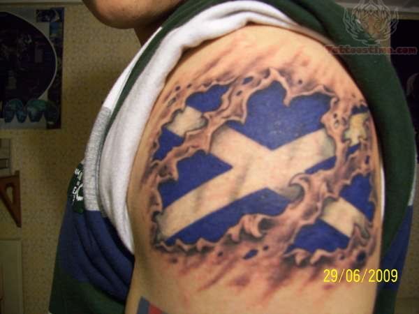 Ripped Skin Scottish Flag Tattoo On Left Shoulder