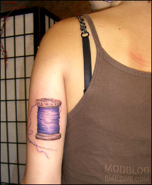 Sewing Spool Tattoo On Left Half Sleeve For Girls