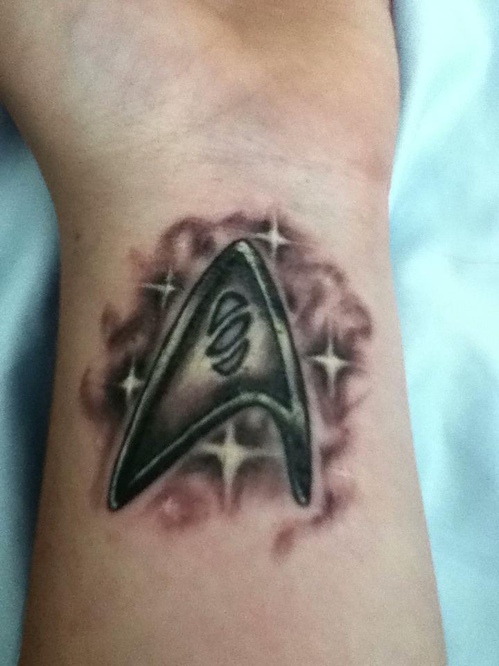 Shinning Star Trek Logo Tattoo On Wrist