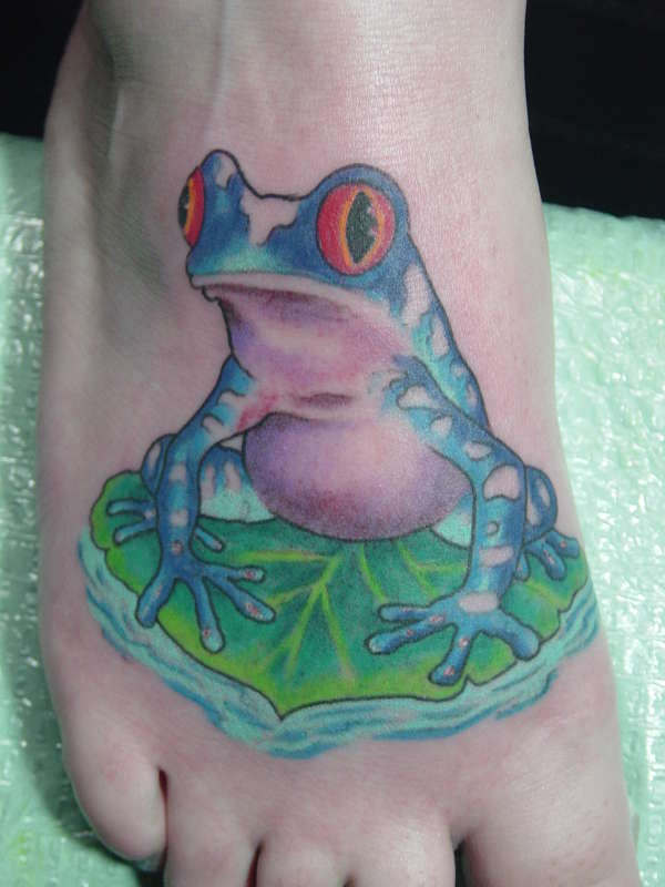 Shocked Frog On Leaf Tattoo On Foot