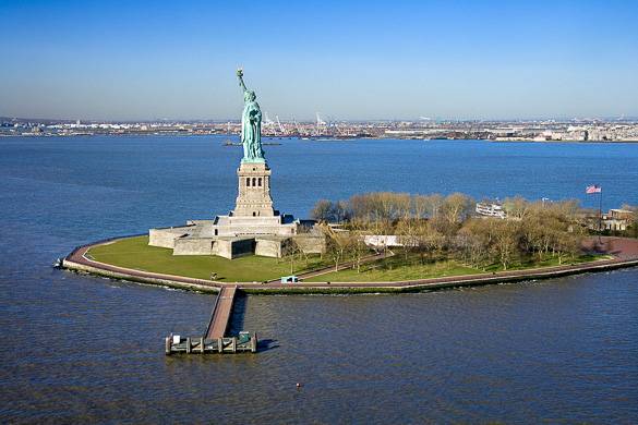 Side View Of Statue Of Liberty And Liberty Island