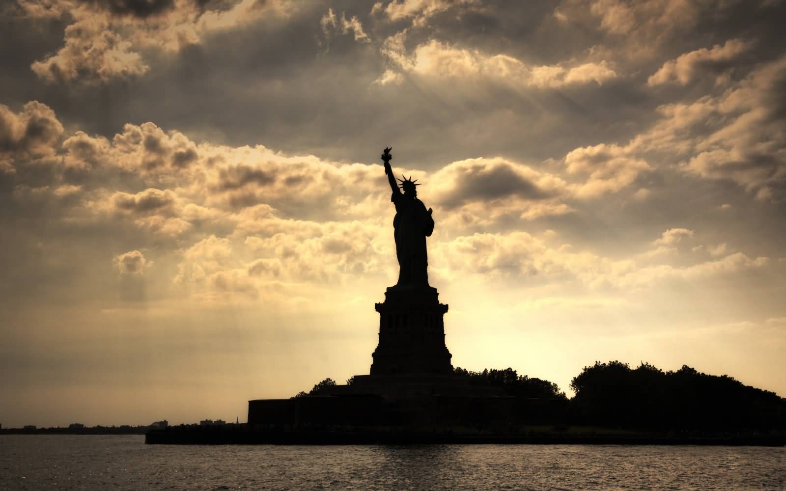 Silhouette View Of Statue Of Liberty During Sunset