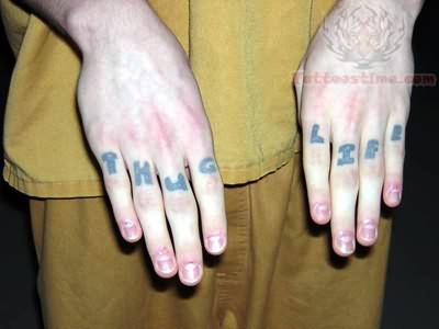 Simple Thug Life Tattoo On Fingers