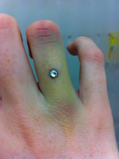 Single Microdermal Piercing On Finger