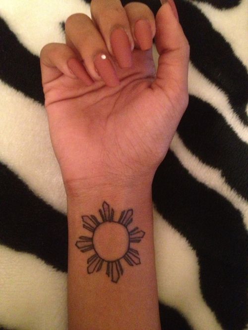 Small Filipino Sun Tattoo On Wrist