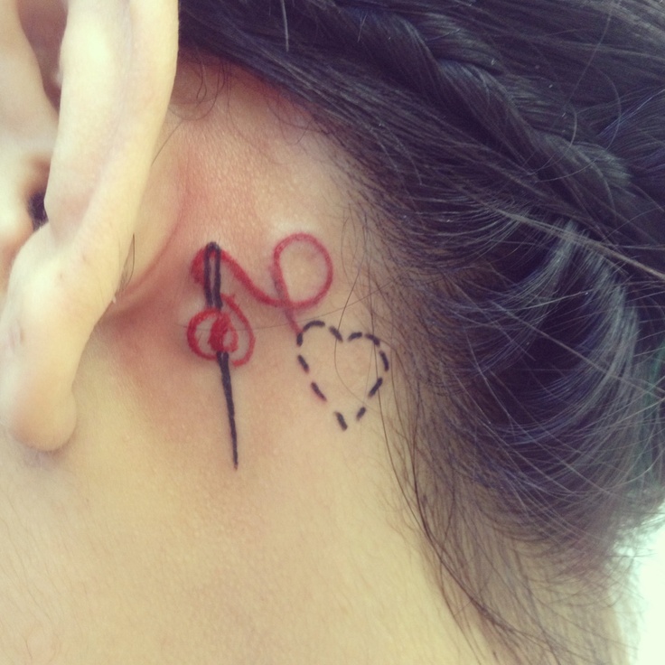 Small Heat Thread And Sewing Needle Tattoo On Behind Ear