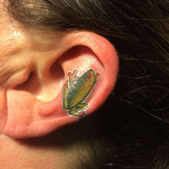 Small Radiant Frog Tattoo On Ear