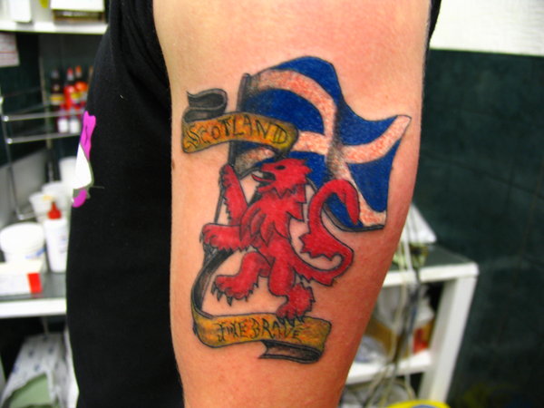 Small Scottish Flag Symbol Tattoo On Half Sleeve