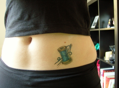 Small Sewing Spool Tattoo On Hip For Girls