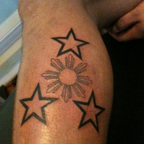 Small Stars Filipino Sun Tattoo On Leg