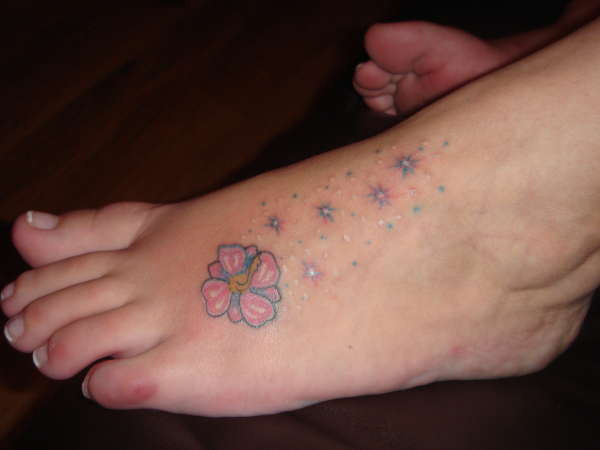 Small Stars Hibiscus Tattoo On Foot