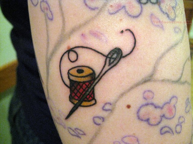 Spool And Needle Sewing Tattoo