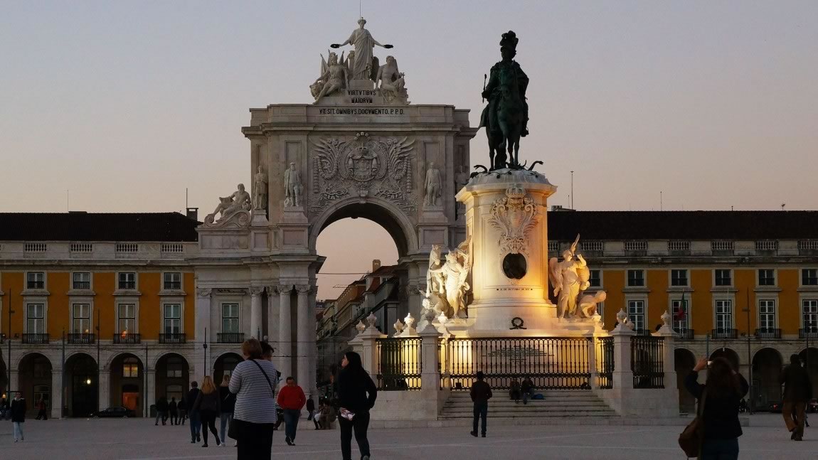 Statue In Front Of Rua Augusta Arch In Lisbon