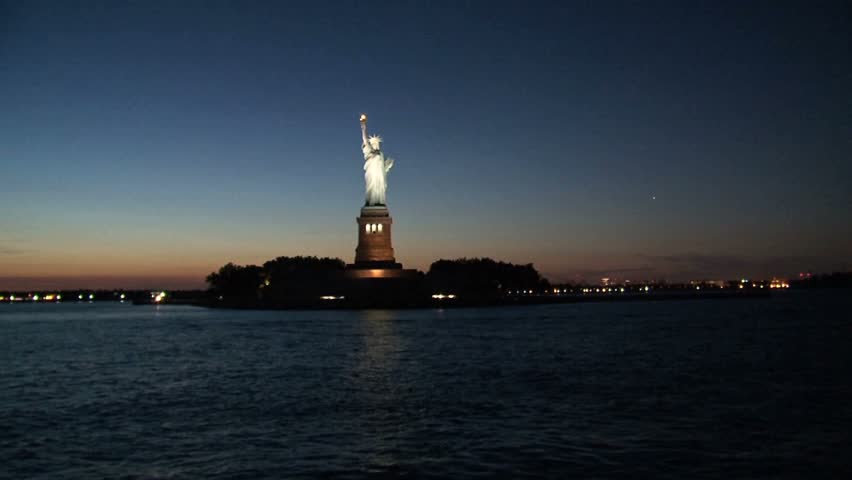Statue Of Liberty Across The River At Night