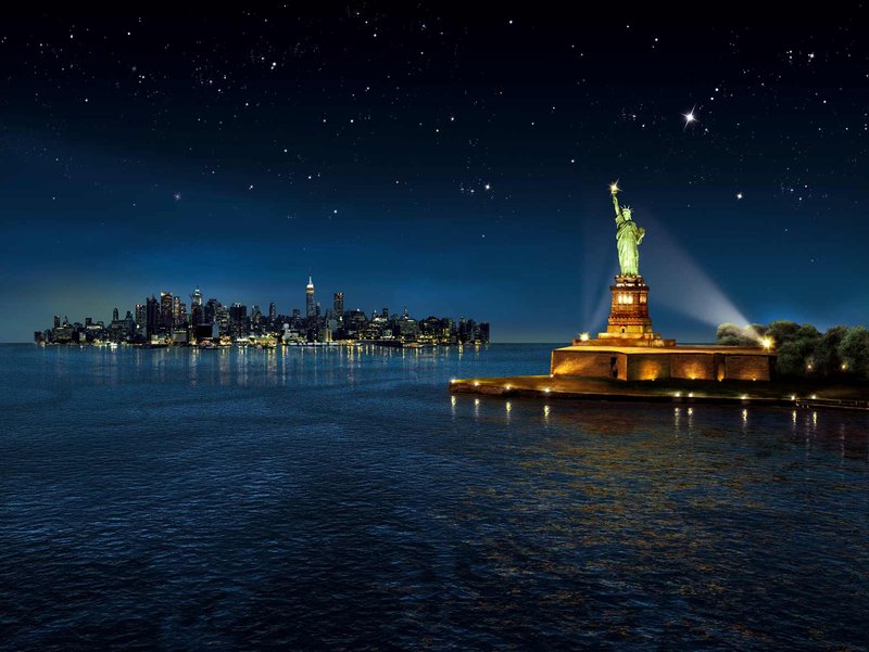 Statue Of Liberty Lit Up At Night