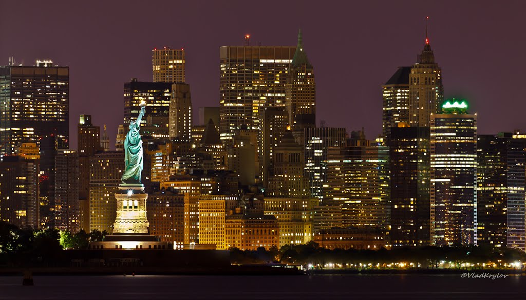 Statue Of Liberty & Manhattan Downtown At Night
