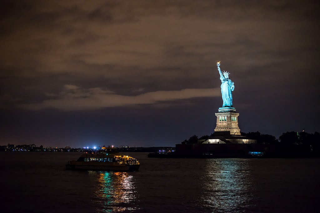 Statue Of Liberty View Across The River At Night