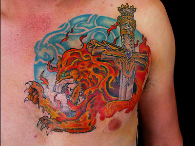 Sword Lion And Flame Tattoo On Chest