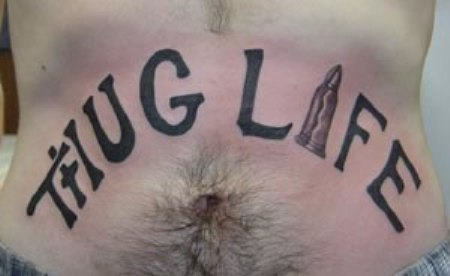 Thug Life Lettering With Bullet Tattoo Around Belly
