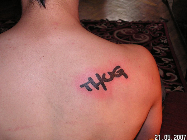Thug Word Tattoo On Right Back Shoulder