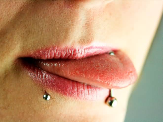 Tongue Piercing And Side Labret Piercing With Silver Stud