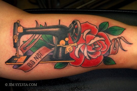 Traditional Sewing Machine With Banner Tattoo On Arm