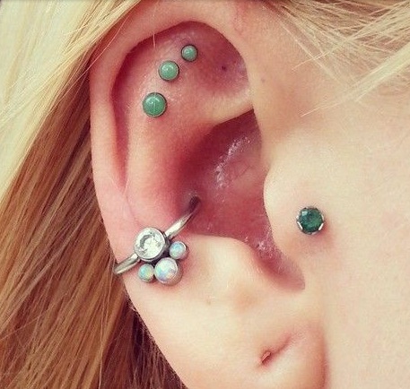 Tragus And Outer Conch Piercing On Girl Right Ear