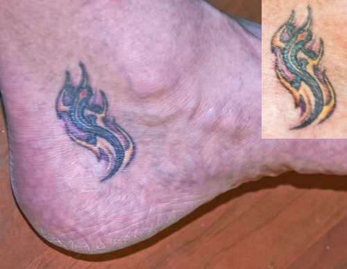 Tribal And Salamander Tattoo On Foot