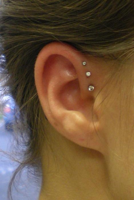 Triple Microdermal Piercings On Girl Right Ear