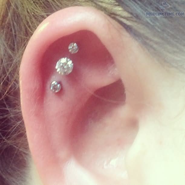 Triple Outer Conch Piercing With Diamond Studs