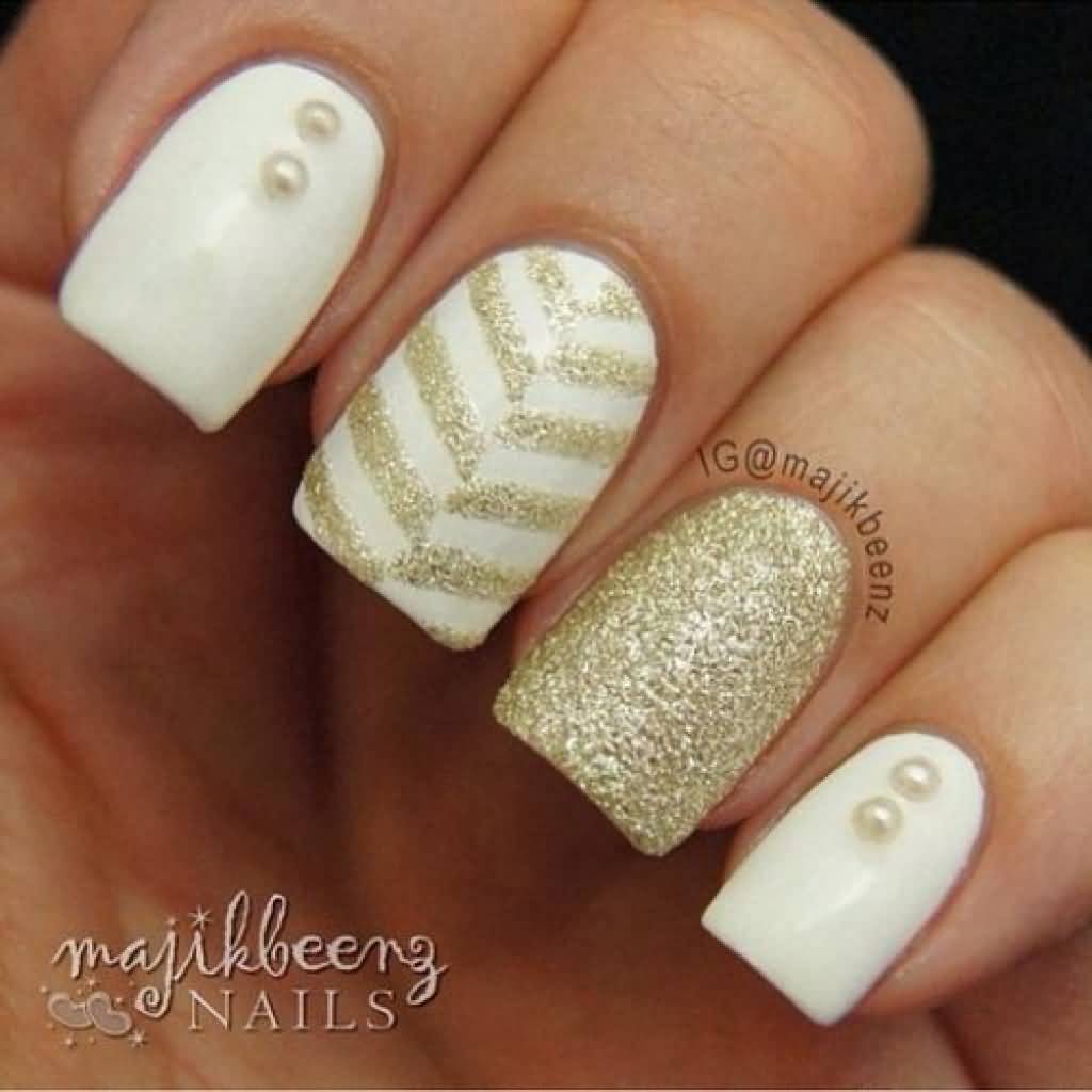 White Nails With Gold Glitter Chevron Design Nail Art