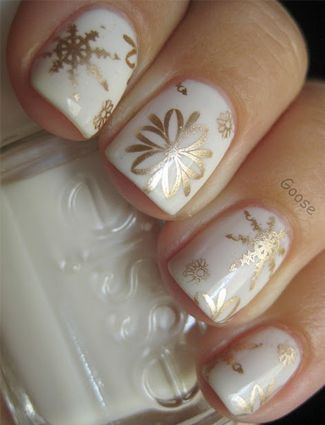 White Nails With Golden Snowflakes Design Nail Art