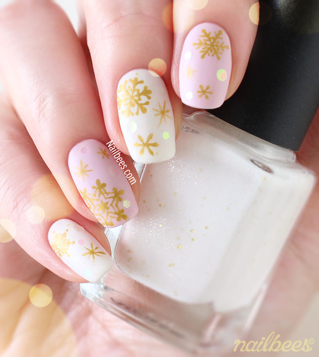White Nails With Golden Snowflakes Nail Art Design