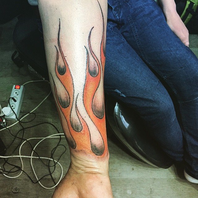 Yellow Color Flame Tattoo On Girl Arm