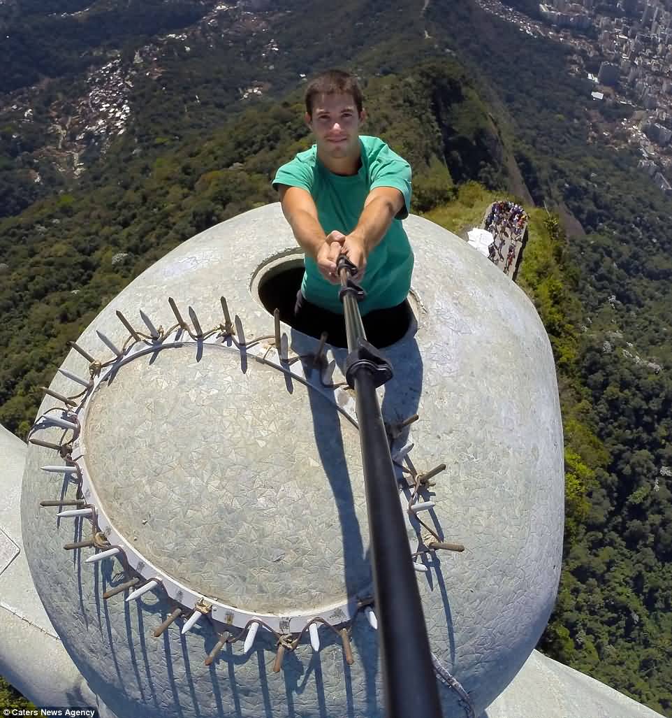 A Man Taking Selfie From The Top Of The Christ The Redeemer Statue