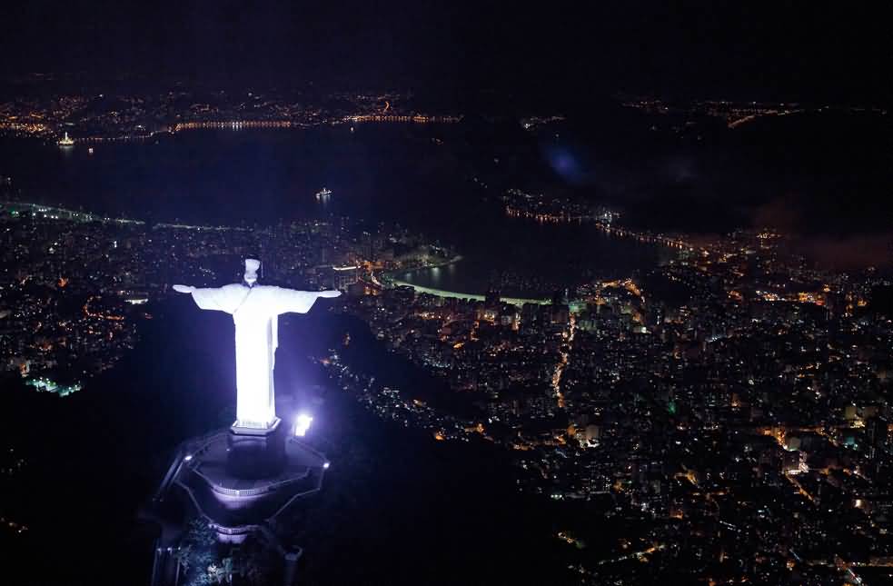 Aerial View of Christ the Redeemer Statue Lit Up At Night