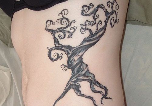 Alice In Wonderland Tree Tattoo On Rib Cage