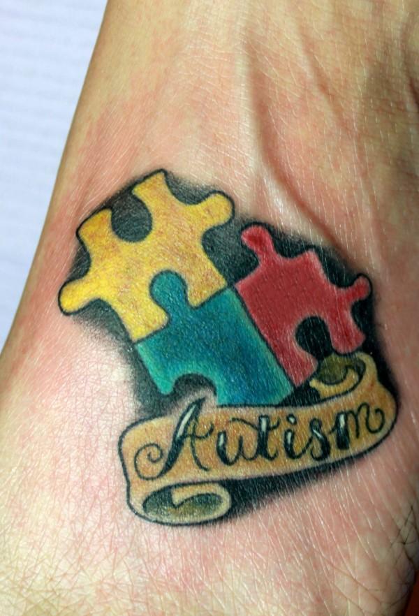 Autism Banner Puzzle Tattoo On Foot