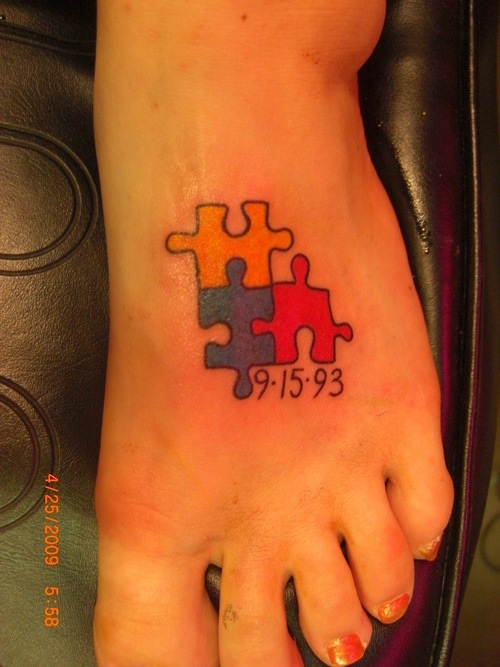 Autism Puzzle Memorial Tattoo On Foot