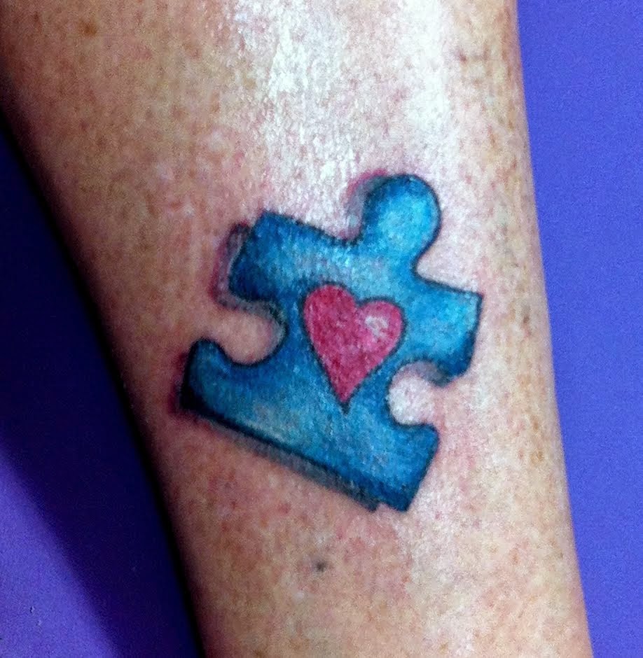 Autism Puzzle Piece With Heart Tattoo On Arm