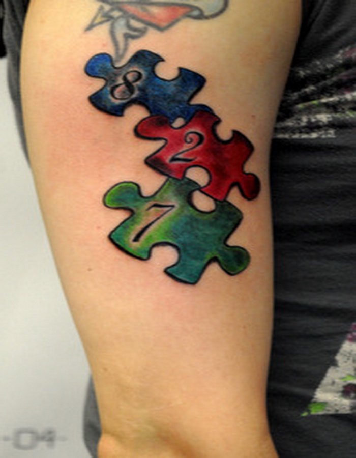 Autism Puzzle Pieces Half Sleeve Tattoo