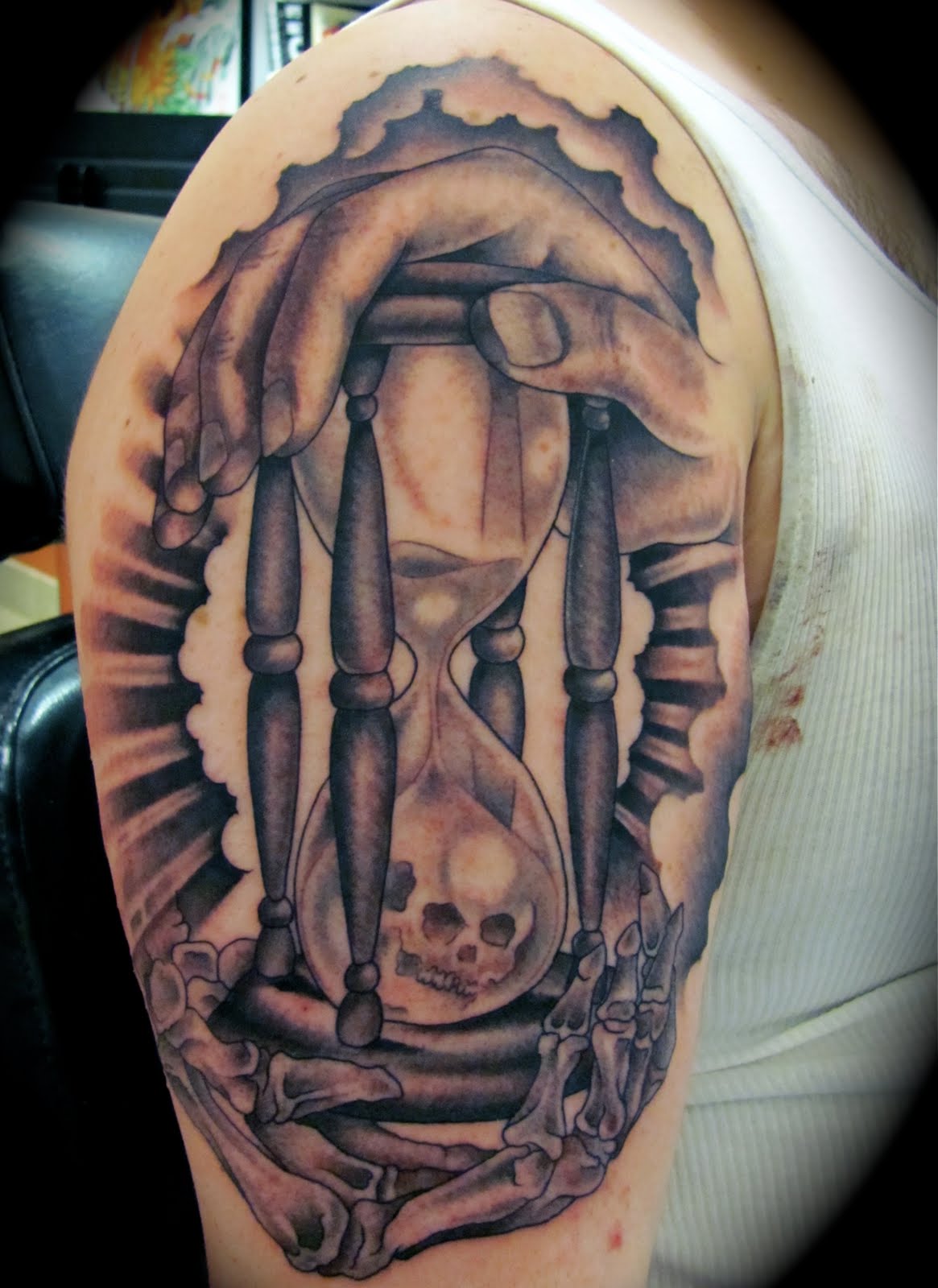Awesome Death Hourglass Tattoo On Right Half Sleeve